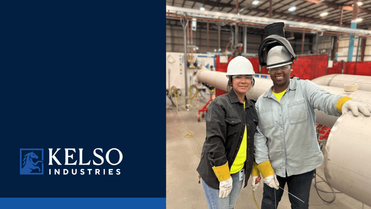 Two Kelso Industries fabrication employees in hard hats and protective work gear beside a large fabricated pipe, with the Kelso Industries logo displayed on the left side of the image.