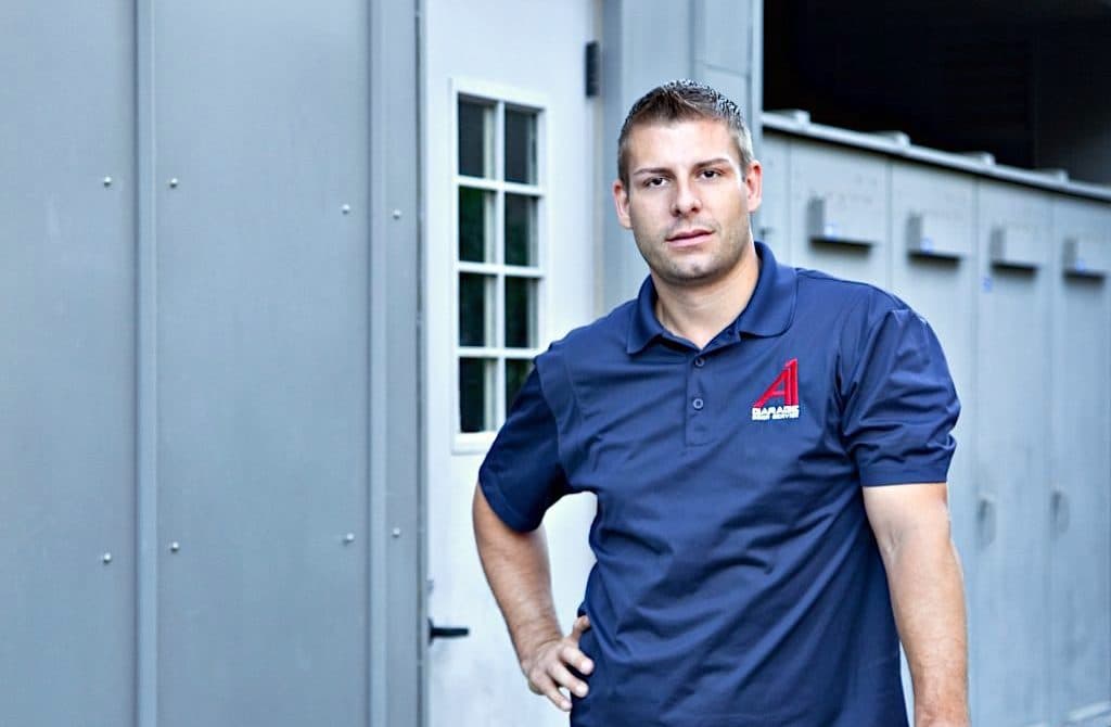 Tommy Mello wearing an earlier A1 Garage Doors polo in a 2018 profile about growing a roughly 30 million dollar home-service company.