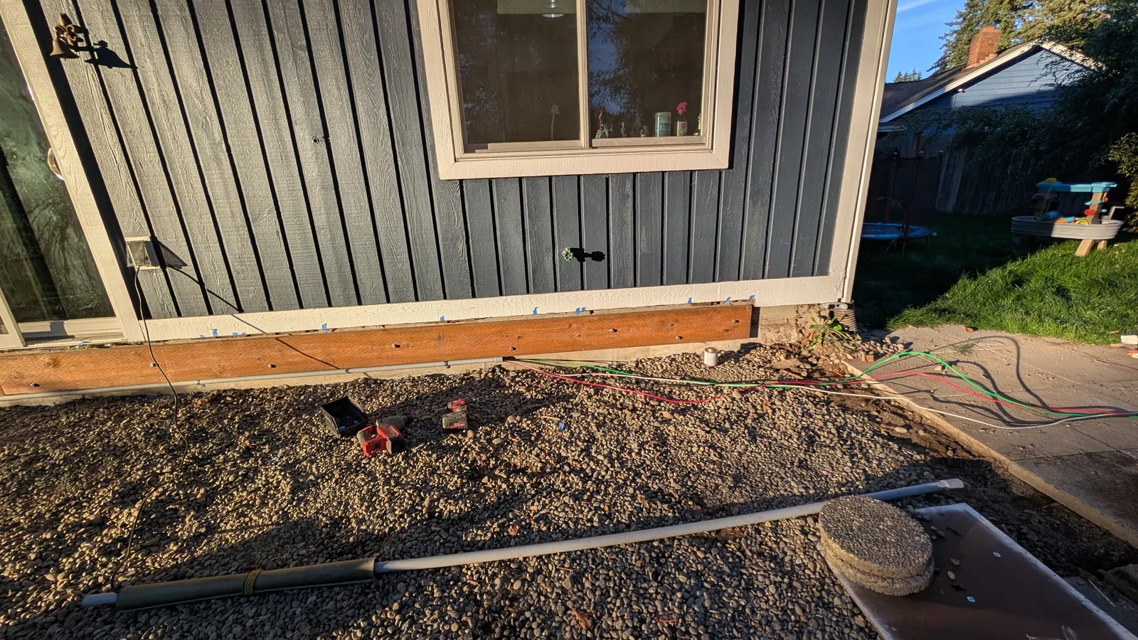 Exterior conduit and foundation area documented during a Brier electrical service visit