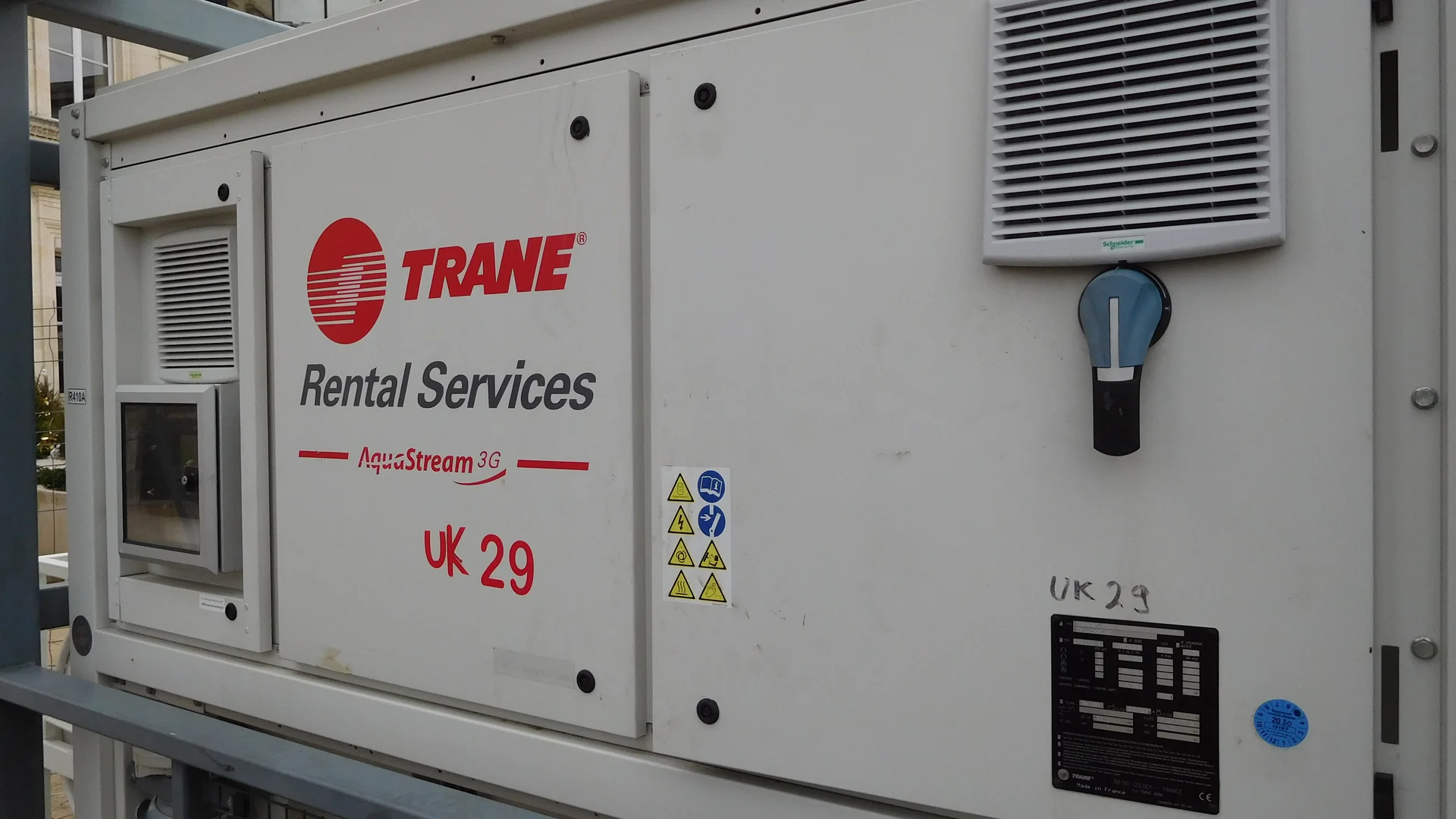 Trane AquaStream 3G rental chiller with branded equipment panels at a temporary ice rink in France.