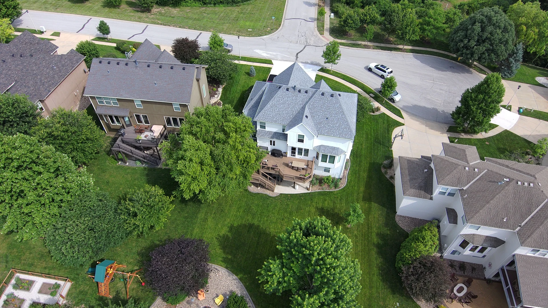 An aerial view of neighboring homes, streets and yards in Olathe, Kansas.